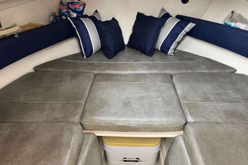 Slide: The Image of Interior cabin of 1999 Boston Whaler 21 Conquest with cushions and pillows. - 8