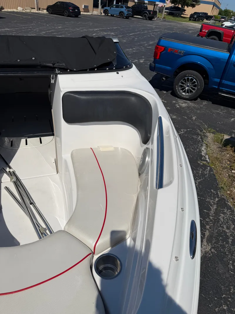Slide: The Image of The image shows the cockpit of a 2013 Four Winns 190 SS boat with white seats and red accents. - 4