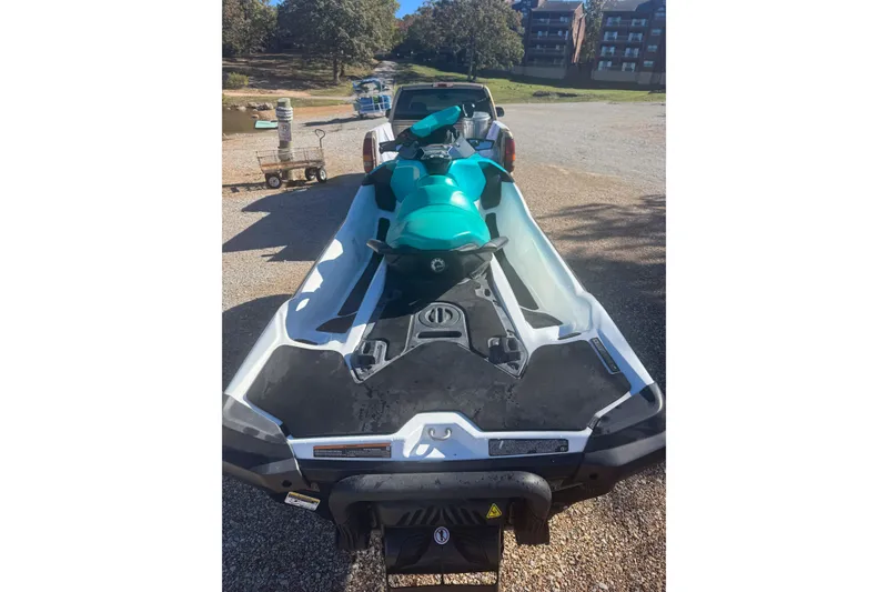 Slide: The Image of 2022 Sea-Doo GTI SE 130 jet ski on trailer, parked outdoors. - 4