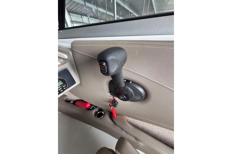 Slide: The Image of Interior view of a 2019 Crownline 215 SS boat throttle control. - 9