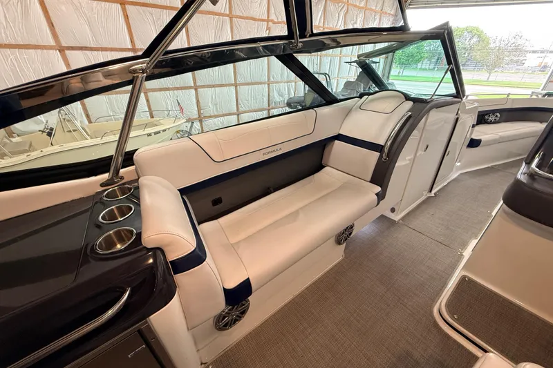 Slide: The Image of 2017 Formula 350 Crossover Bowrider OB interior with luxurious seating and cup holders. - 20