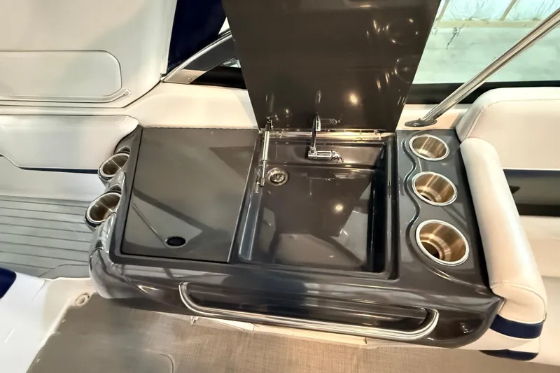 Slide: The Image of 2017 Formula 350 Crossover Bowrider OB boat sink with cup holders and sleek design. - 21