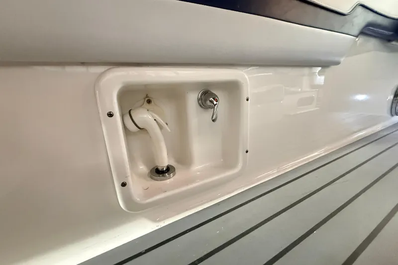 Slide: The Image of 2017 Formula 350 Crossover Bowrider OB boat deck with built-in shower and faucet. - 46