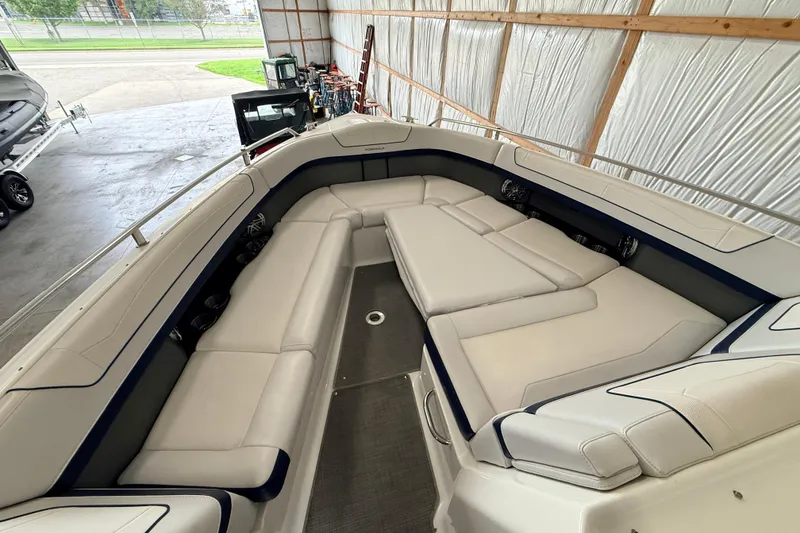 Slide: The Image of 2017 Formula 350 Crossover Bowrider OB with spacious seating in a covered storage area. - 26
