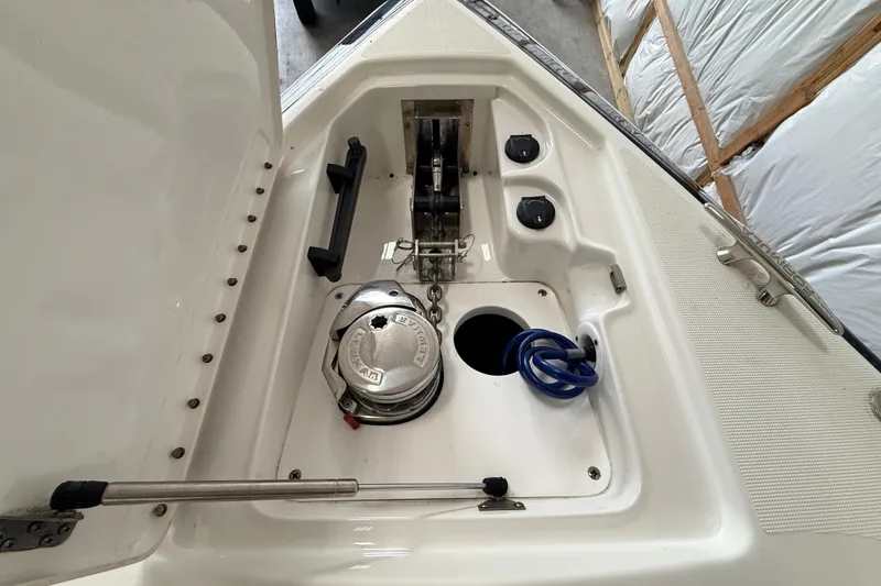 Slide: The Image of 2017 Formula 350 Crossover Bowrider OB anchor compartment with winch and storage features. - 31