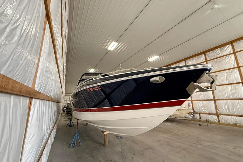 Slide: The Image of 2017 Formula 350 Crossover Bowrider OB in storage, showcasing sleek design and spacious interior. - 4
