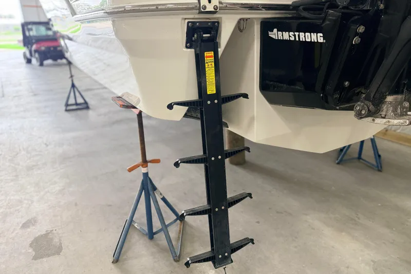 Slide: The Image of 2017 Formula 350 Crossover Bowrider OB with Armstrong ladder in a garage setting. - 8