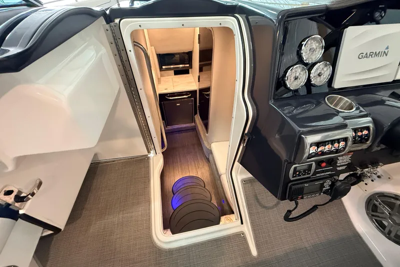 Slide: The Image of 2017 Formula 350 Crossover Bowrider OB interior with Garmin navigation and cabin access. - 42