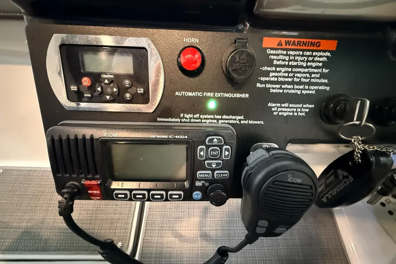 Slide: The Image of Control panel of a 2017 Formula 350 Crossover Bowrider OB with safety warnings. - 12