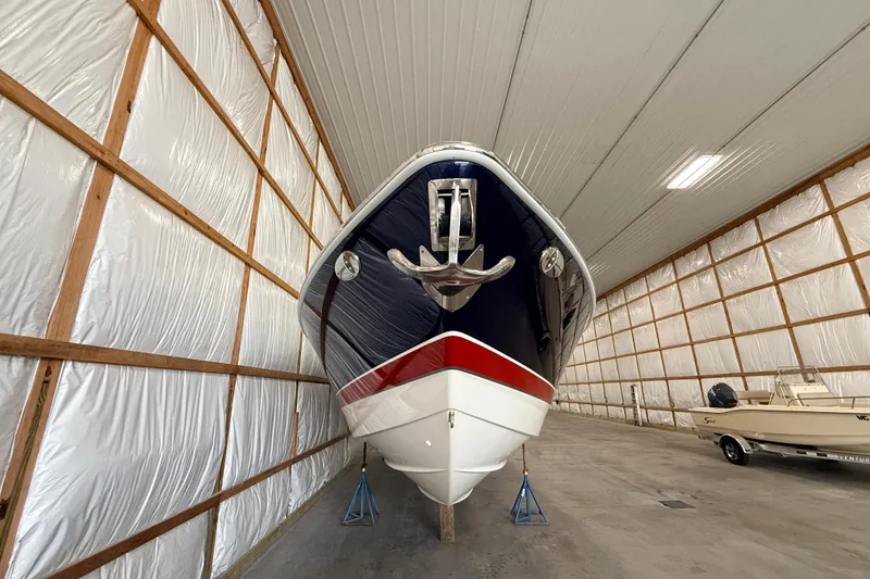 Slide: The Image of 2017 Formula 350 Crossover Bowrider OB stored indoors, showcasing sleek design and vibrant colors. - 5