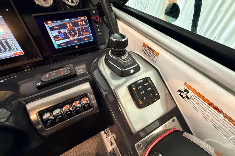 Slide: The Image of Control panel of 2017 Formula 350 Crossover Bowrider OB with joystick and digital displays. - 15