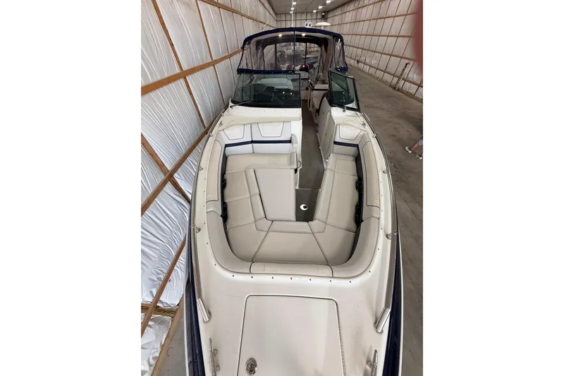Slide: The Image of 2017 Formula 350 Crossover Bowrider OB in storage, showcasing spacious seating and sleek design. - 28