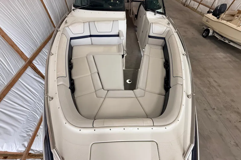 Slide: The Image of 2017 Formula 350 Crossover Bowrider OB with spacious seating in a storage facility. - 29