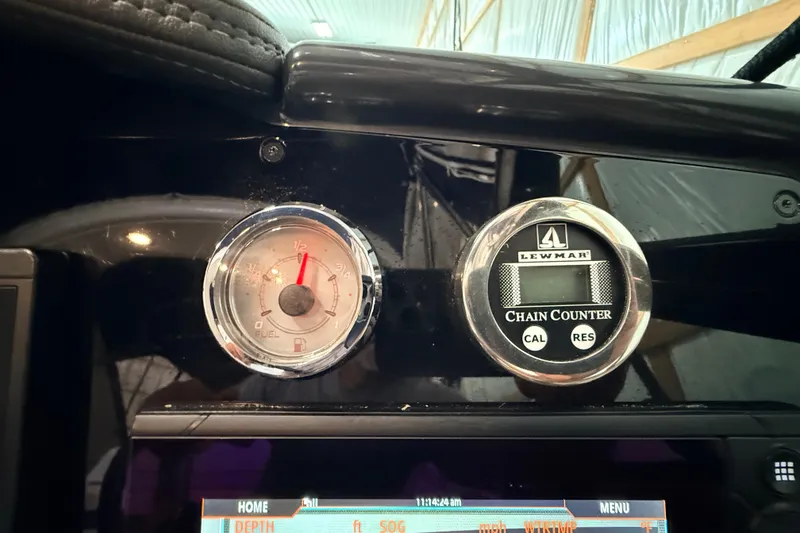 Slide: The Image of Dashboard of a 2017 Formula 350 Crossover Bowrider OB with fuel gauge and Lewmar chain counter. - 13