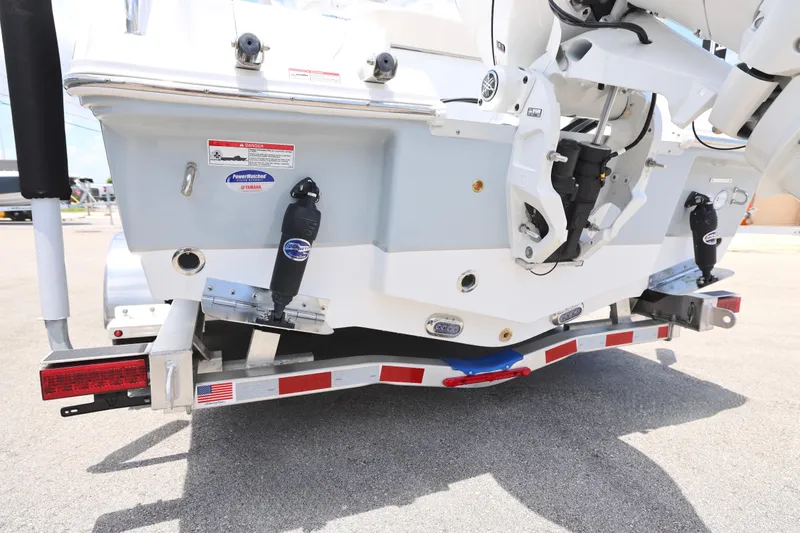 Slide: The Image of Rear view of a 2027 Sea Hunt Ultra 219 boat on a trailer. - 10