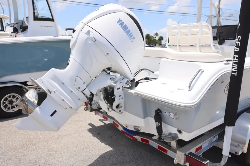 Slide: The Image of 2027 Sea Hunt Ultra 219 boat with Yamaha outboard motor on trailer. - 26