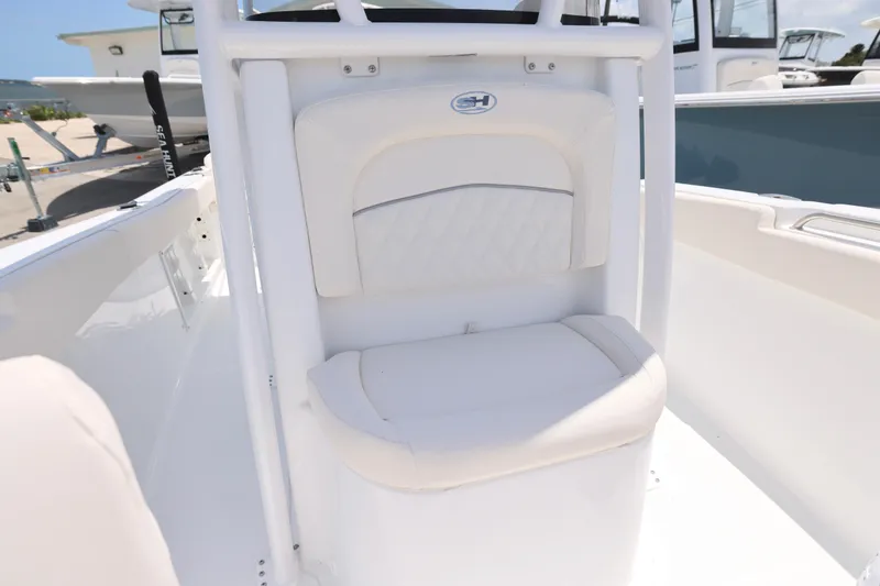 Slide: The Image of 2027 Sea Hunt Ultra 219 boat seat with white upholstery and sleek design. - 18