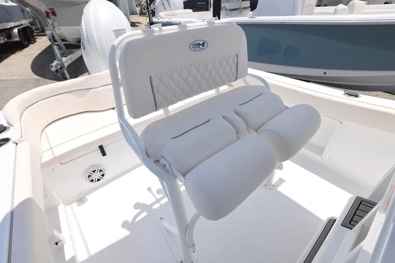 Slide: The Image of 2027 Sea Hunt Ultra 219 boat interior with cushioned seating and modern design. - 23