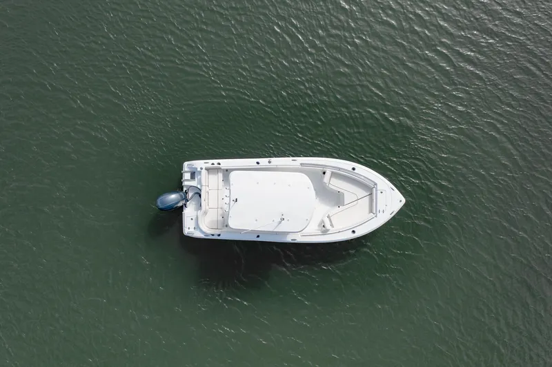 Slide: The Image of Aerial view of 2027 Sea Hunt Ultra 219 boat on calm water. - 35
