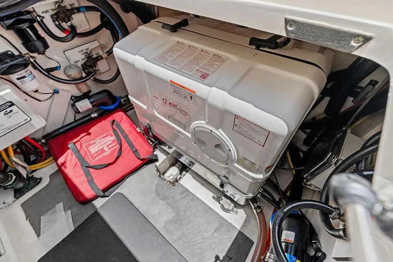 Slide: The Image of Engine compartment of 2021 Scout 425 LXF boat, featuring equipment and wiring. - 41