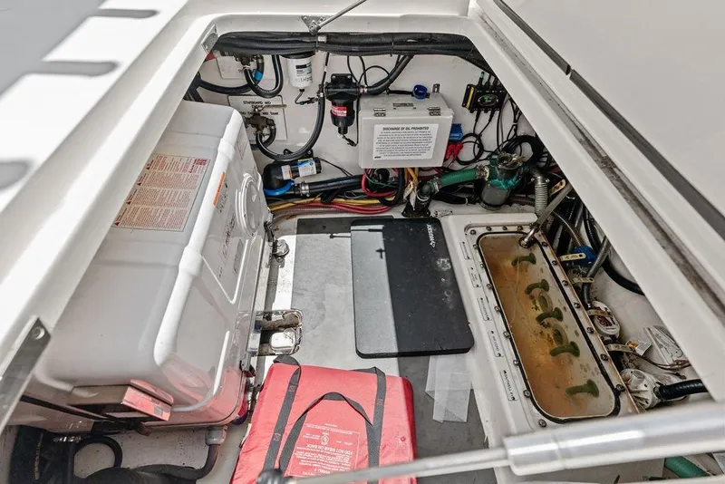 Slide: The Image of Engine compartment of 2021 Scout 425 LXF boat, showcasing equipment and wiring. - 38