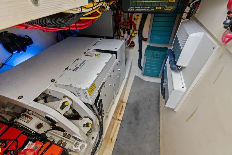 Slide: The Image of Engine compartment of 2021 Scout 425 LXF boat, showcasing electrical systems and wiring. - 40