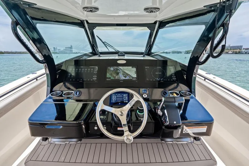 Slide: The Image of Helm of 2021 Scout 425 LXF boat with advanced navigation system and controls. - 27