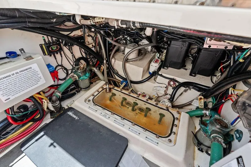 Slide: The Image of Engine compartment of a 2021 Scout 425 LXF boat, showcasing wiring and components. - 39