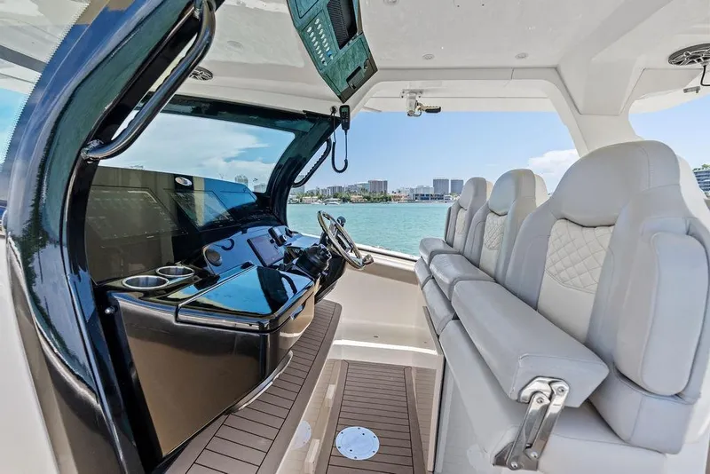 Slide: The Image of 2021 Scout 425 LXF boat interior with modern helm and luxurious seating. - 25