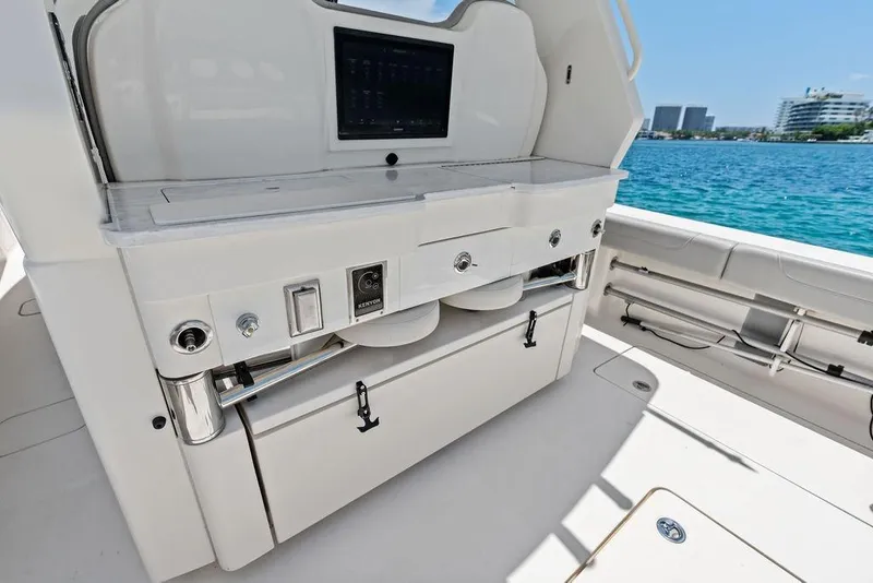 Slide: The Image of 2021 Scout 425 LXF boat interior with sleek white cabinetry and ocean view. - 21