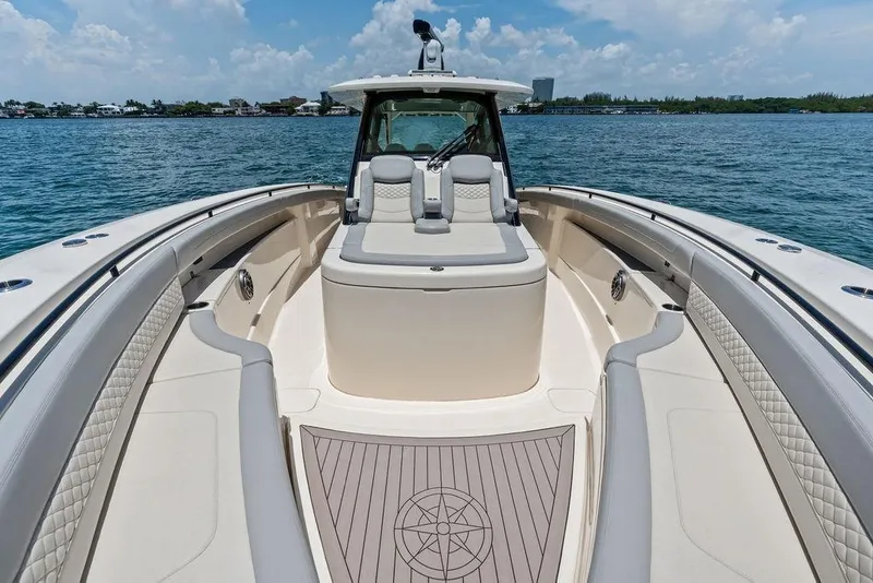 Slide: The Image of Luxurious 2021 Scout 425 LXF boat interior with cushioned seating and ocean view. - 15