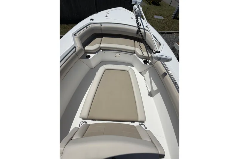 Slide: The Image of 2016 Boston Whaler 280 Outrage boat interior with cushioned seating and trolling motor. - 9