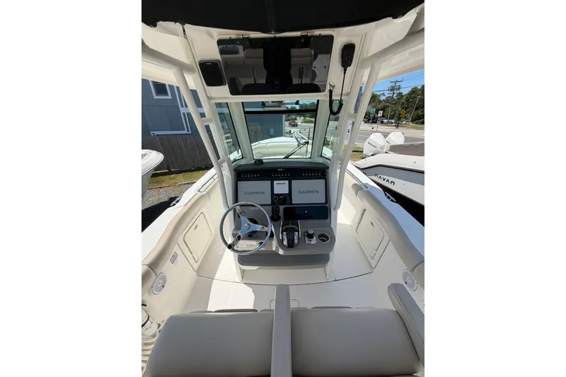 Slide: The Image of 2016 Boston Whaler 280 Outrage helm with Garmin navigation system and steering wheel. - 7