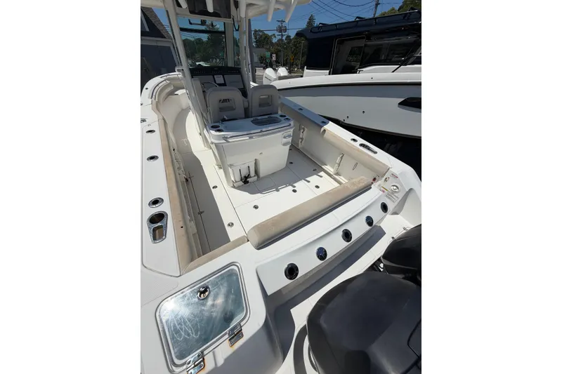Slide: The Image of 2016 Boston Whaler 280 Outrage boat interior with seating and console. - 4