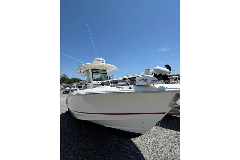 Slide: The Image of 2016 Boston Whaler 280 Outrage boat with Garmin equipment under clear blue sky. - 1