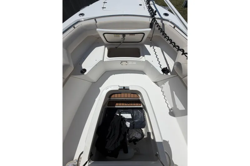 Slide: The Image of 2016 Boston Whaler 280 Outrage boat interior with storage compartments and seating. - 10