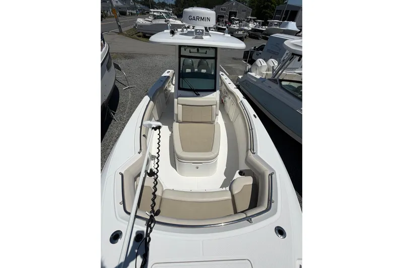 Slide: The Image of 2016 Boston Whaler 280 Outrage boat with Garmin equipment, docked in a marina. - 11