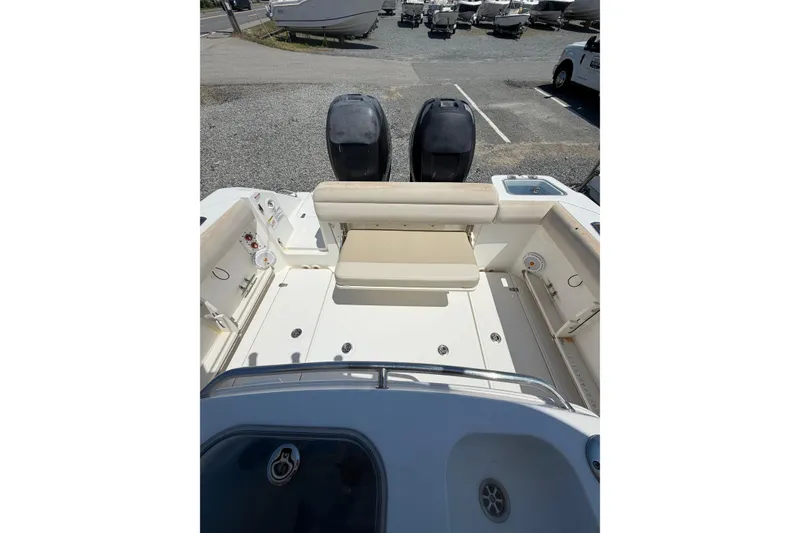Slide: The Image of 2016 Boston Whaler 280 Outrage boat interior with seating and dual engines. - 5