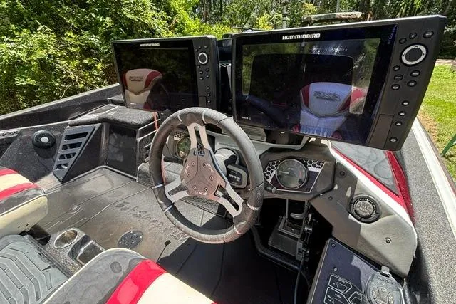 Slide: The Image of 2022 Skeeter FXR21 Limited boat cockpit with dual Humminbird displays and modern steering wheel. - 7