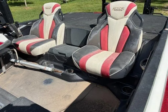 Slide: The Image of 2022 Skeeter FXR21 Limited boat interior with red and white seats. - 6