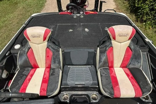 Slide: The Image of 2022 Skeeter FXR21 Limited boat interior with red and black seats. - 9