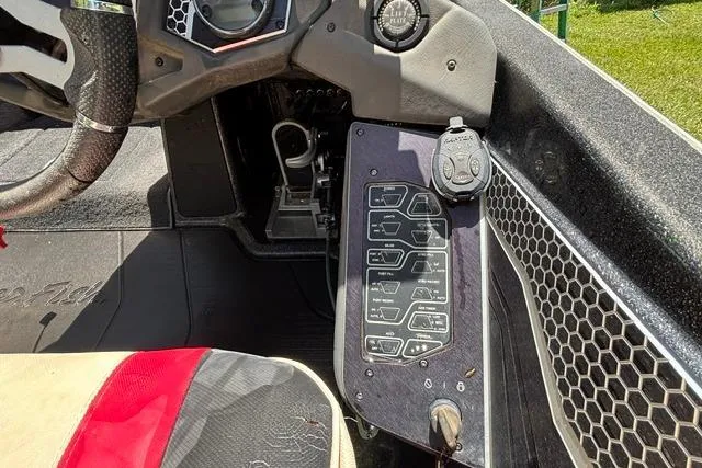Slide: The Image of 2022 Skeeter FXR21 Limited boat dashboard with control panel and steering wheel. - 11