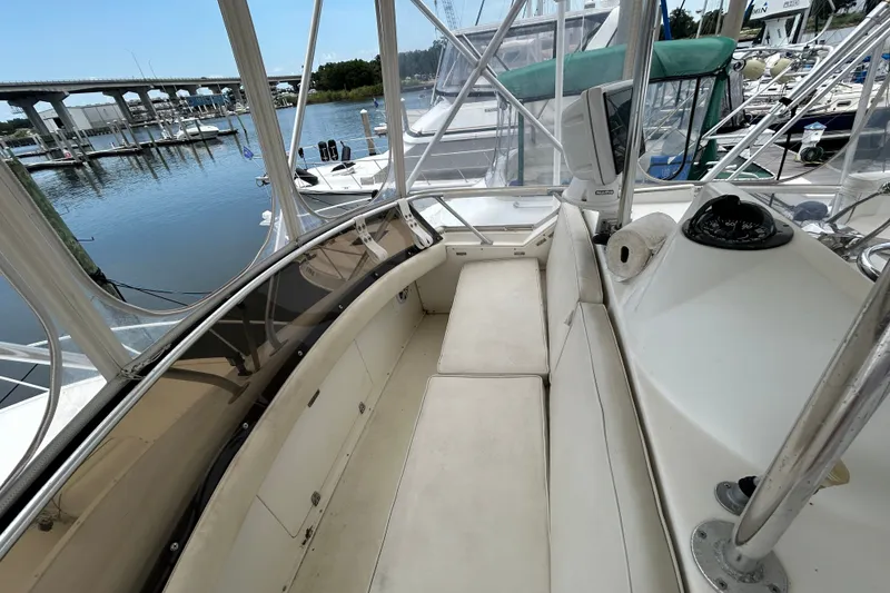 Slide: The Image of 1990 Bertram 37 Convertible yacht interior with marina view. - 13