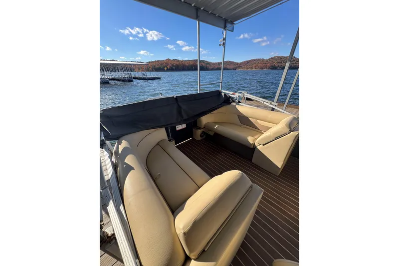 Slide: The Image of 2020 Crest Classic LX 220 L pontoon boat interior with lake view. - 4