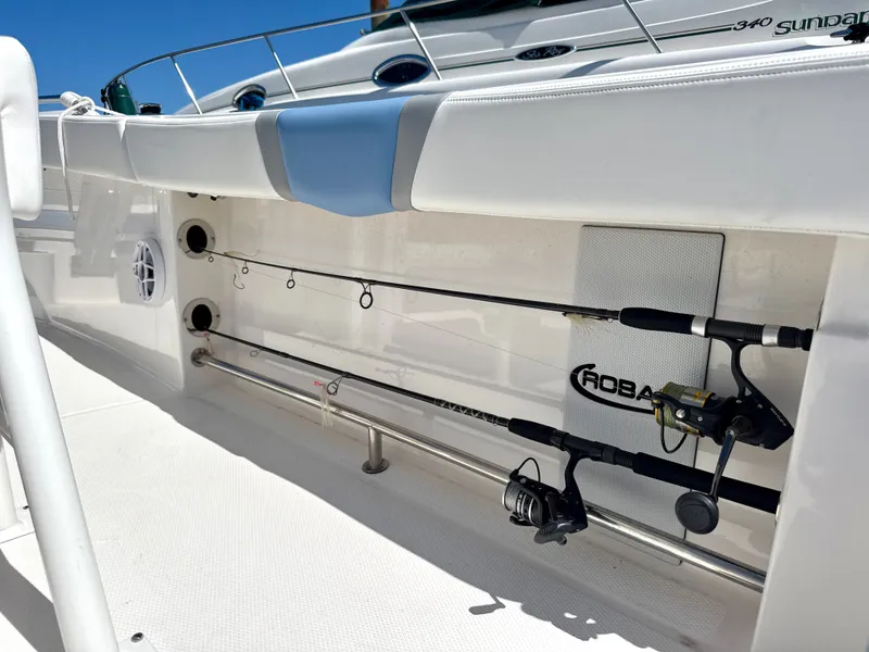 Slide: The Image of Fishing rod holder on the Robalo R232 Explorer, featuring two mounted rods. - 5