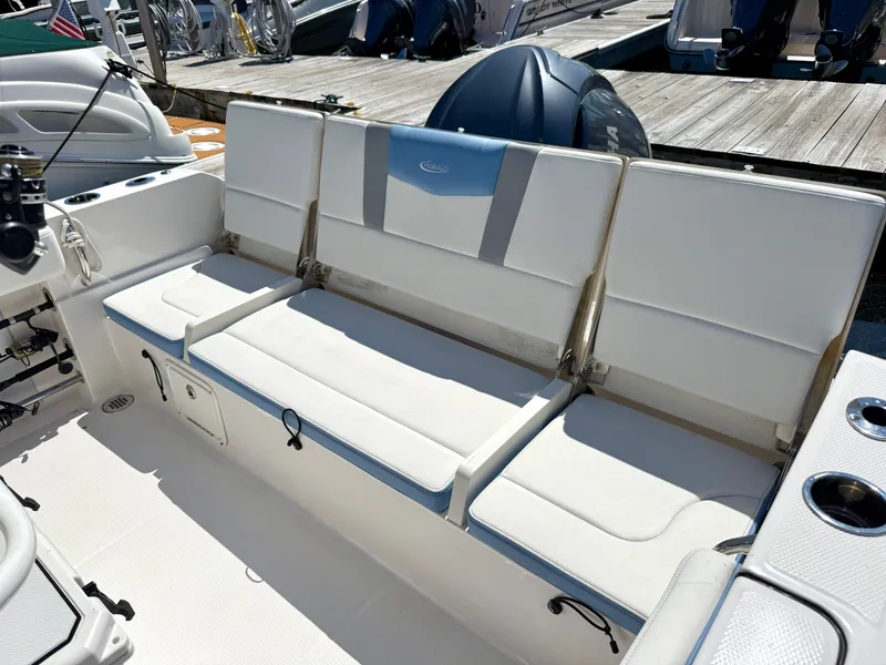 Slide: The Image of The 2025 Robalo R232 Explorer features a spacious, cushioned bench seat in the aft area. - 4