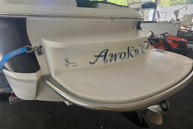 Slide: The Image of 2005 Cobalt 250 boat stern with "Awak'n II" name, docked at San Ramon Boat Center. - 6