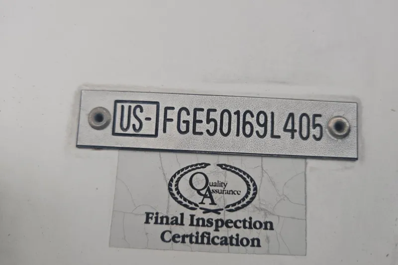 Slide: The Image of 2005 Cobalt 250 inspection plate with serial number and quality assurance certification. - 5