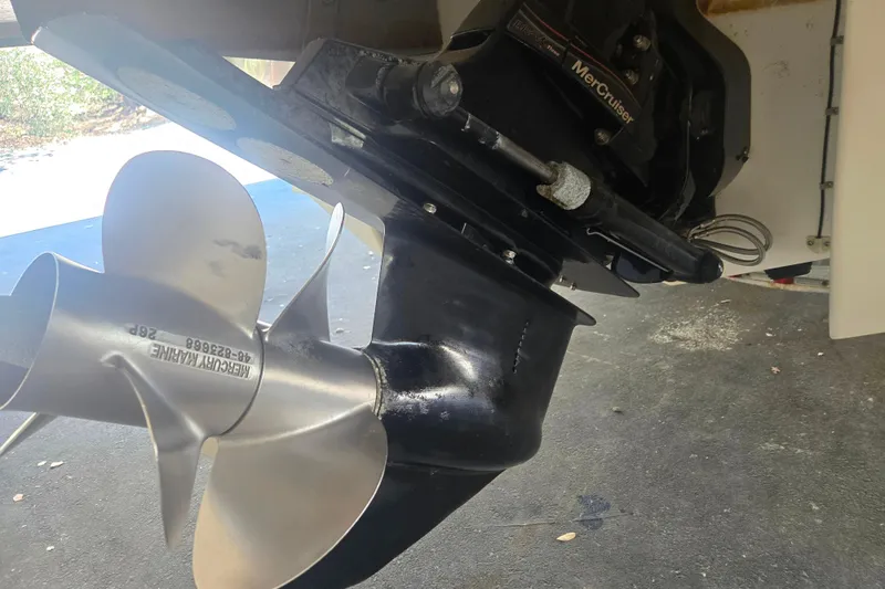 Slide: The Image of Close-up of a 2005 Cobalt 250 boat's MerCruiser propeller and drive system. - 3