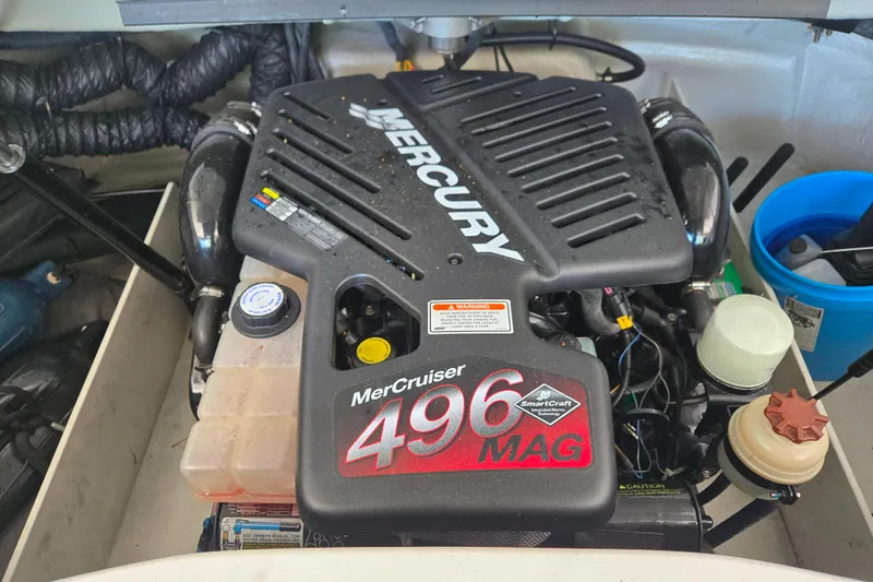 Slide: The Image of 2005 Cobalt 250 boat engine, MerCruiser 496 MAG, in a maintenance setting. - 14